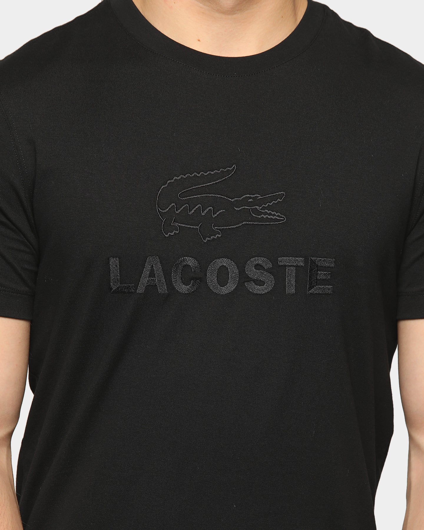 all black lacoste shirt