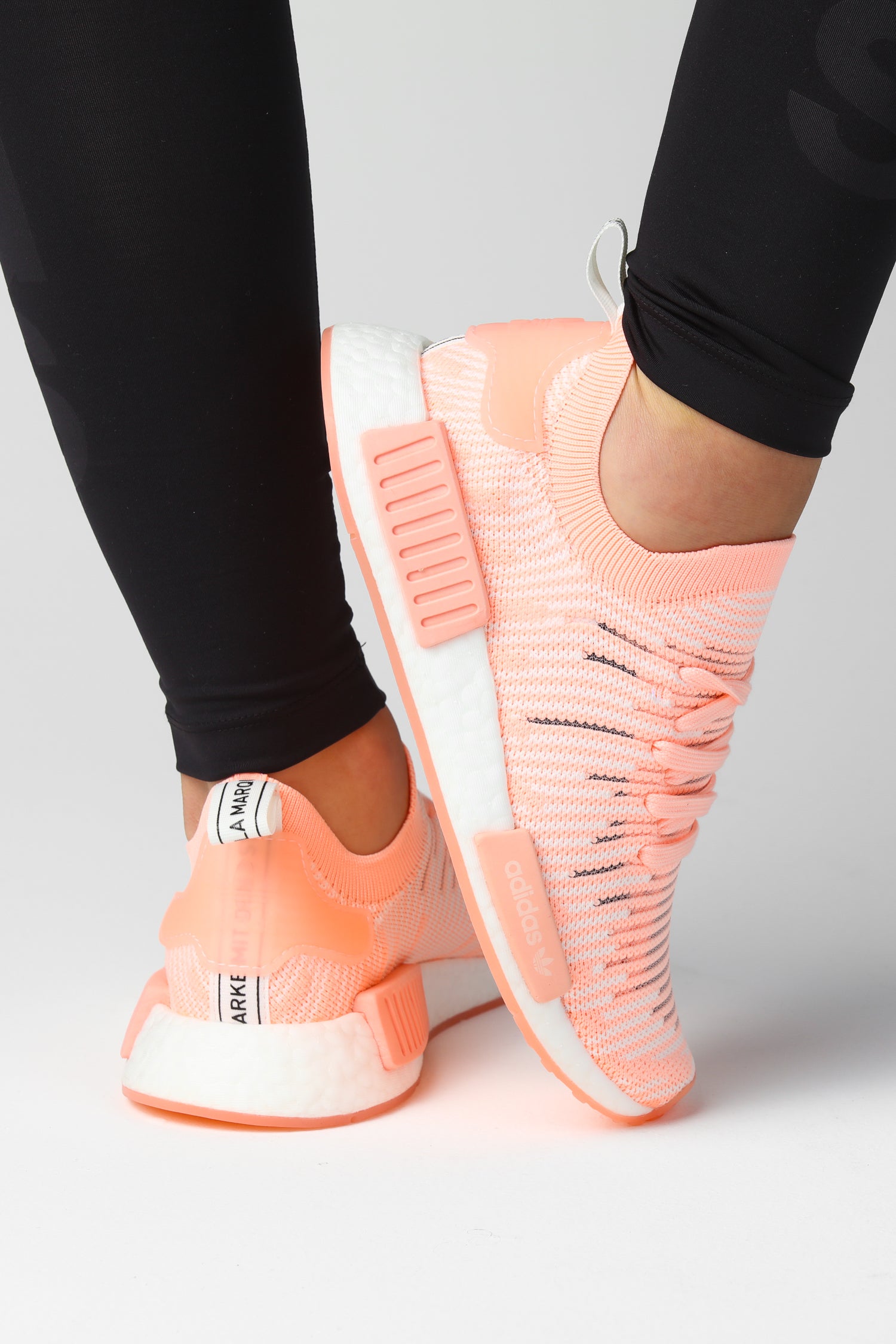 nmd_r1 stlt primeknit shoes clear orange