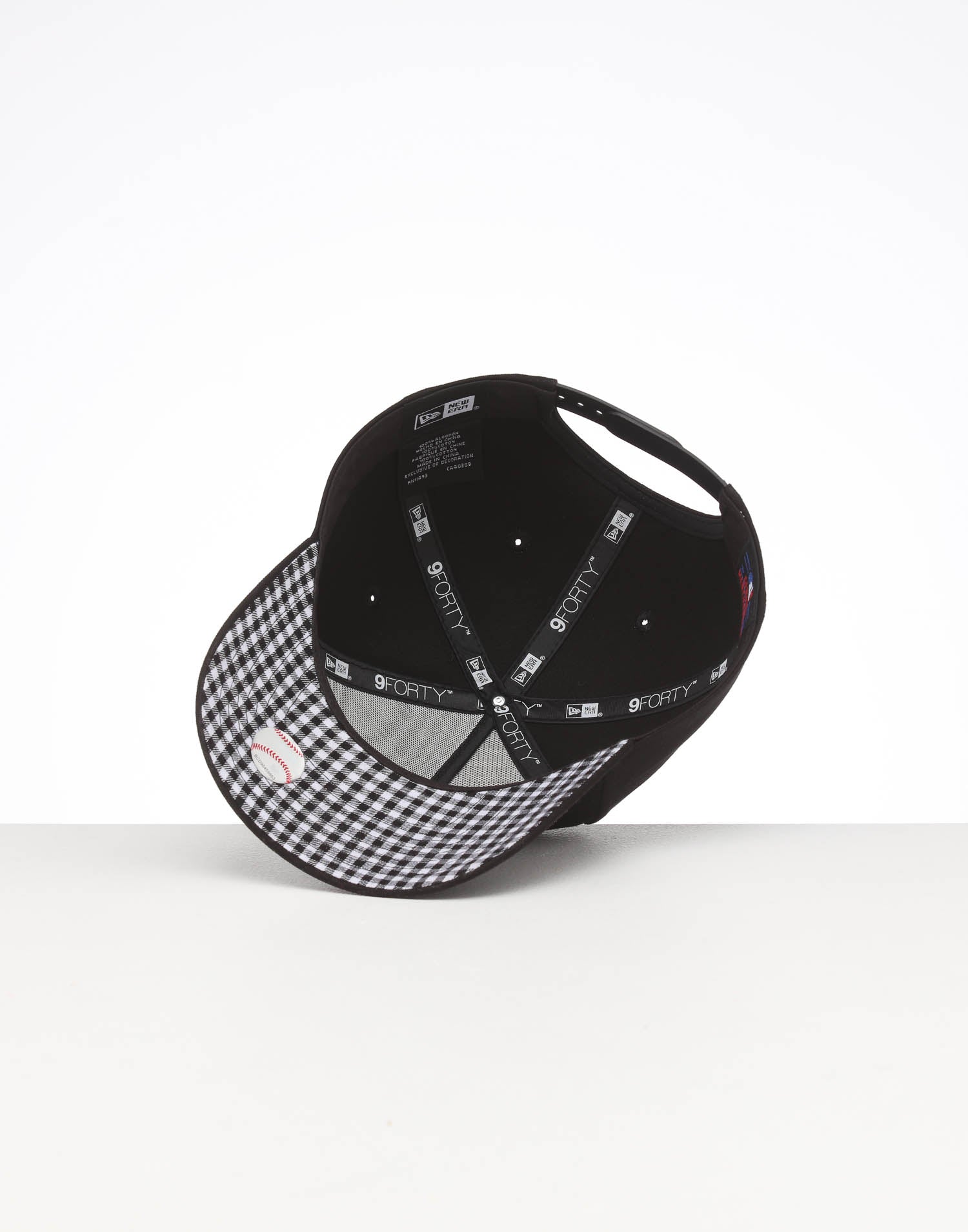 black and white checkered baseball cap