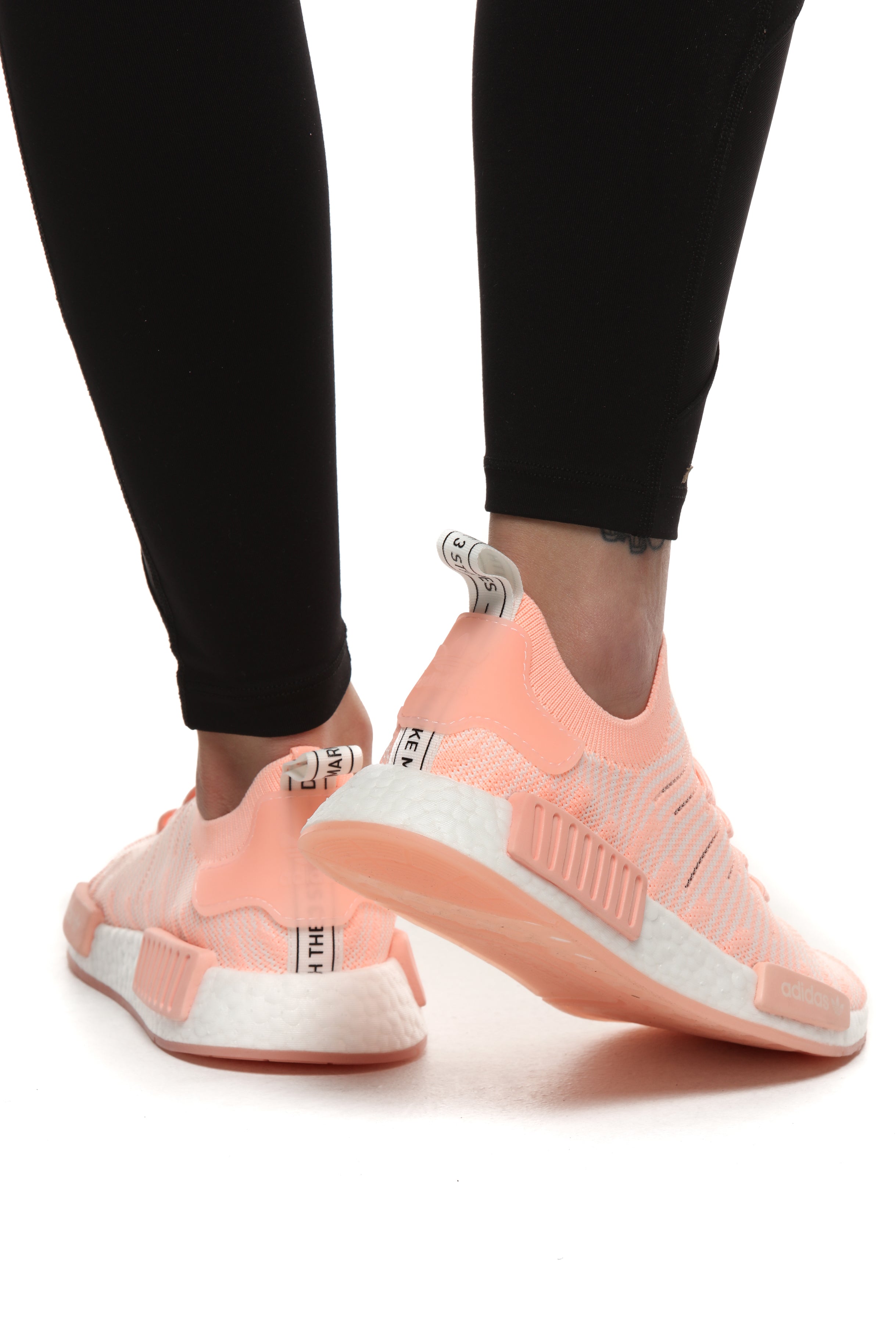 nmd_r1 stlt primeknit shoes clear orange