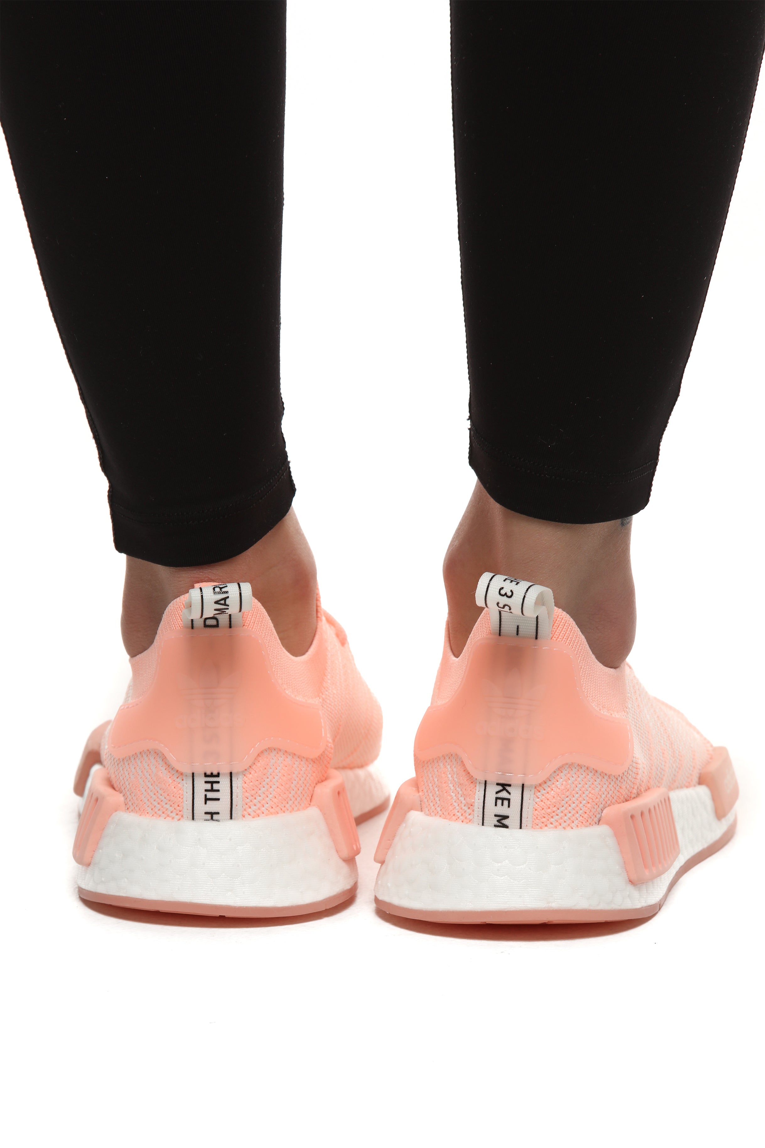 nmd_r1 stlt primeknit shoes clear orange