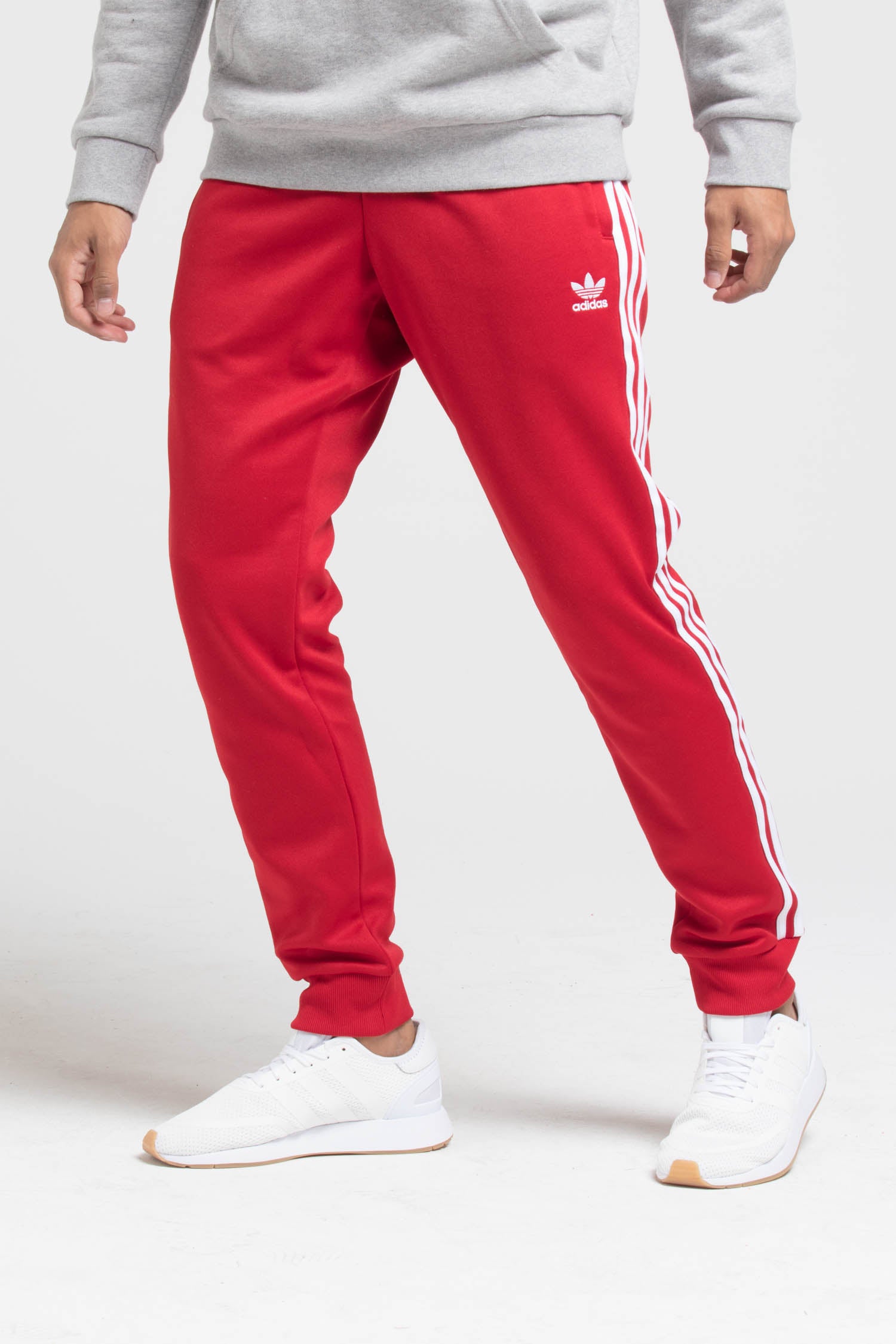 adidas sst track pants mens red