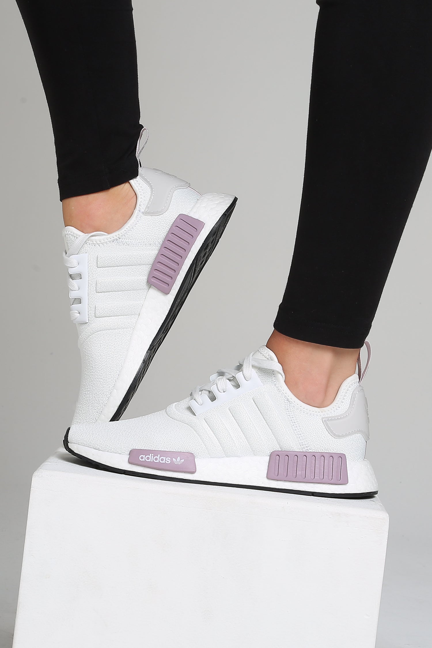 white nmds with purple