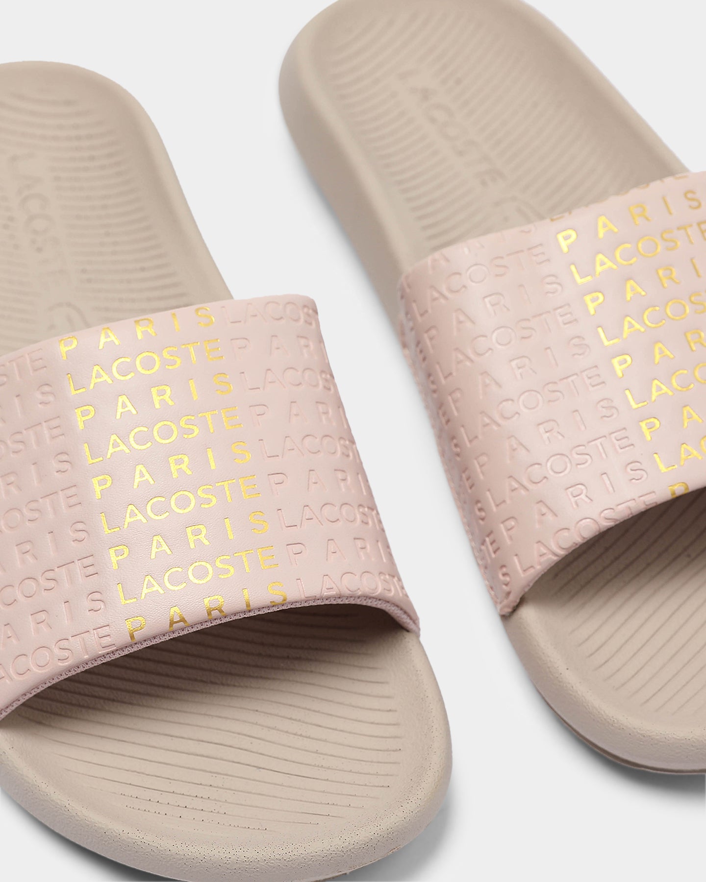 white and gold lacoste slides