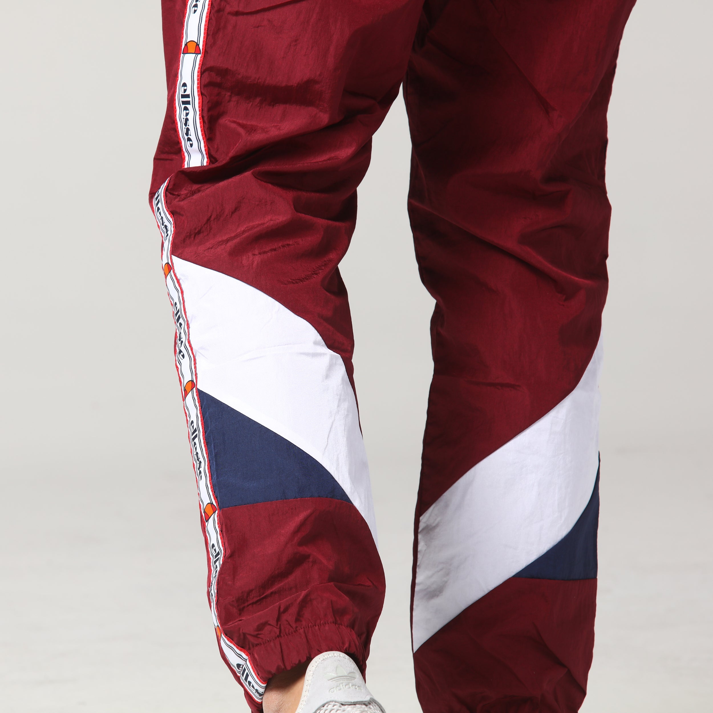 nike burgundy track pants