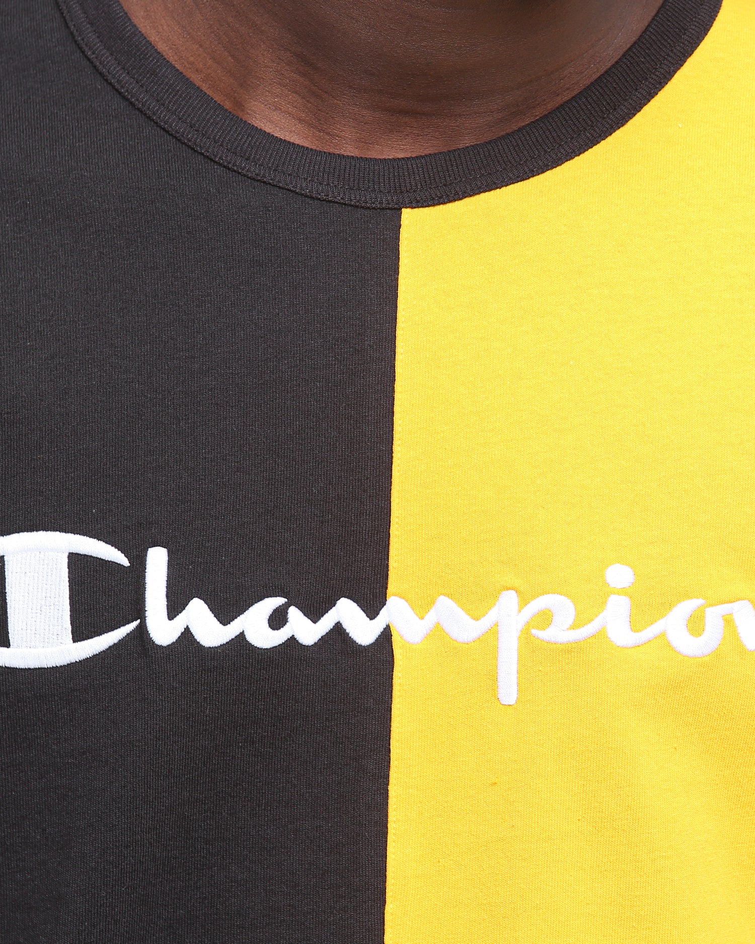 black and yellow champion shirt